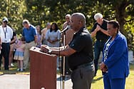 Pastor Sean Dogan leading a prayer at the historical marker dedication ceremony